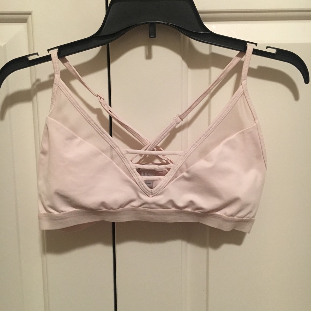 Blush pink strappy sports bra